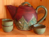 teapot green leaf with tea bowls